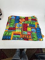 Folded money print fleece blanket showing overall pattern and size