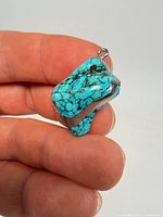 Front view of turquoise pendant showing color and texture