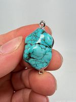 front view of turquoise nugget showing color and veining
