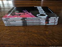 Spine view of six Criminal trade paperbacks stacked