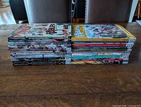 Side view stack of all 22 Fables volumes showing spines and Vertigo branding