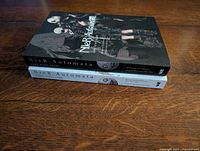 Stacked view showing spines and partial covers of both novels