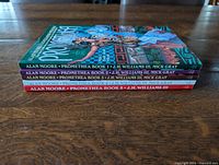 Spine view of five Promethea books stacked