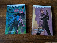 Front covers of both Sleeper Season One and Season Two trade paperbacks