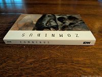Book spine showing title Zomnibus and IDW logo
