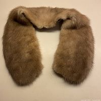 Full view of blond mink fur collar laid flat