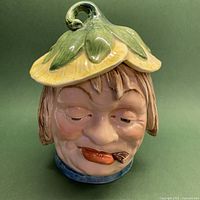 Full view of ceramic lidded vessel front