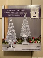 Front of retail package showing pair of clear lighted glitter trees, set of two