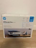 Front of retail box showing HP OfficeJet Pro 8035 printer image and Instant Ink label
