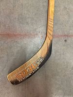 Blade of Sherwood 5030 Feather-Lite wood hockey stick showing model and branding