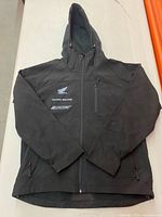 Front view showing hood, Honda and Joe Rocket logos, zip pockets