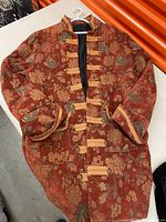 Front view of jacquard tapestry blazer jacket showing fabric, pattern, trim and overall condition
