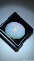 Top view of oval opal cabochon in display box