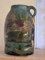 Front view showing cabin, trees, dogs, ducks