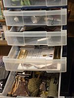 Overview of plastic drawer unit with contents partially open