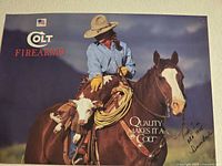 Full view of signed Colt Firearms poster on wall