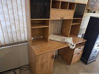 Front view of desk showing hutch, drawers, cabinet