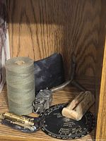 Entire group showing navigation computer, grapnel hook, tape roll, mechanical device, rubber sheet, tan block