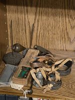 Group shot showing drill box, weighted stands, plumb bobs, goggles, conduit and chain