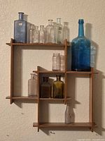 Overall view of wood shelf with all bottles in place