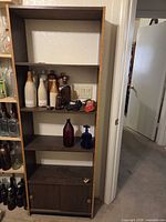 Full view of shelving unit and some contents