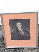 Framed portrait showing image, mat, and metal frame