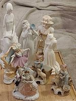 Group shot of all eight porcelain figurines