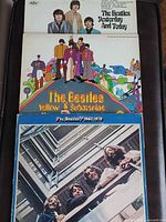 Three Beatles LPs stacked: Yesterday And Today, Yellow Submarine, 1967-1970
