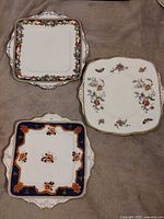 Three Paragon square serving plates displayed together
