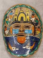 Front view of hand-painted ceramic mask