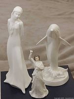 All three Royal Doulton porcelain figurines grouped