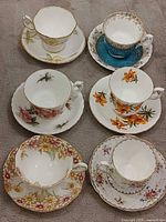 All six Royal Albert teacup and saucer sets displayed