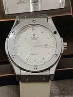 Front view of Hublot Genève quartz watch head without band