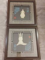 Both framed white jade carvings front view