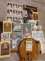 Entire lot spread showing magazine, glove, cards, book and photos