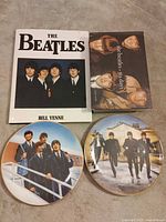 Group shot: two Beatles plates and two hardcover books