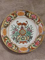 Front view of Famille Rose porcelain plate showing full decoration