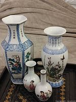 Group of five Chinese porcelain vases on tray