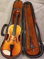 Violin front in open case with bow