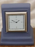 Front view of Wedgwood Portland Blue mantel clock