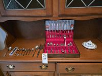 Overall view of flatware case and additional loose pieces