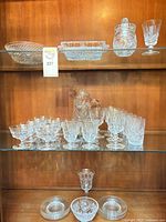Overall cabinet view showing majority of crystal pieces