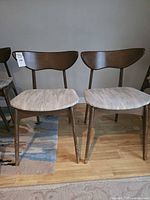 front view of both matching mid-century chairs