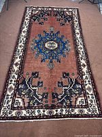 Full view of antique Tafresh Hamadan carpet showing overall design and borders