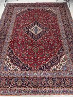 Full view of Kashan rug showing complete design and size proportions