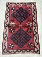 Full view of Shiraz rug showing pattern and borders