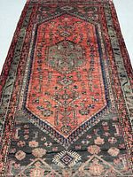 Full length view of Zanjan rug showing field, borders and fringe