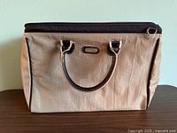 Front view showing taupe exterior and handles