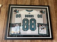 Front view of framed Brent Burns #88 Sharks jersey with photos and logos