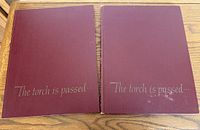 Front covers of both maroon books showing silver title text